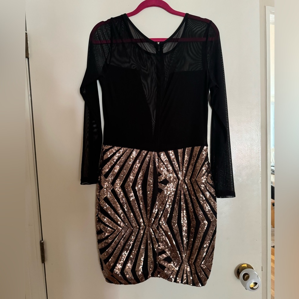 Stunning dress with mesh top and gorgeous sequin pattern bottom. NWOT